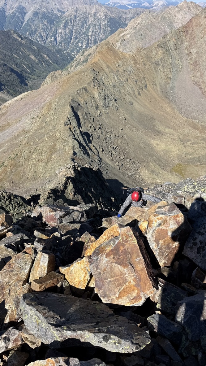 Maya scrambling up the ridge towards West Trinity